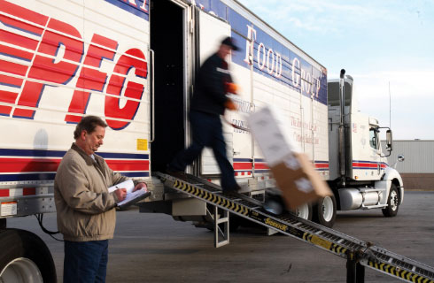 Customized Employee unloading a delivery truck